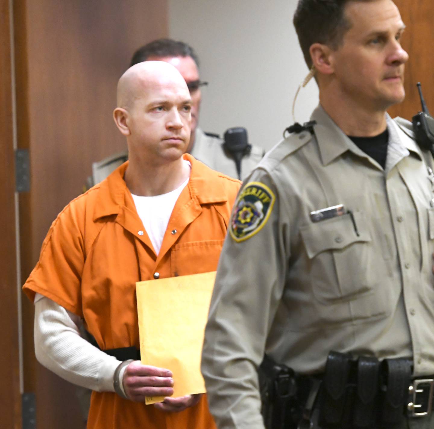 Matthew Plote is escorted into an Ogle County courtroom by court officials on Thursday, Jan. 19.