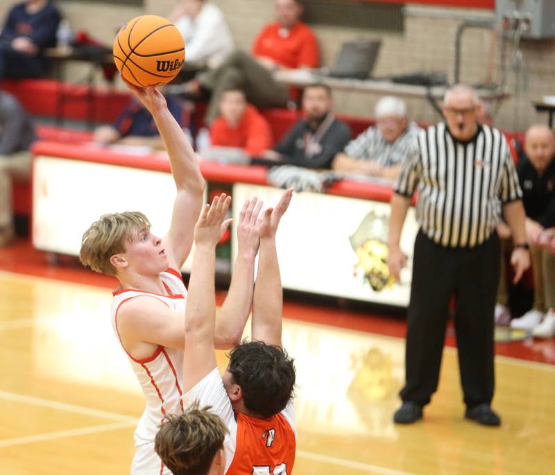 Ottawa's Owen Sanders eyes the hoop as Pontiac's Hector Garcia defends during the Dean Riley Shootin' The Rock Thanksgiving Tournament on Monday, Nov. 25, 2024 in Kingman Gym at Ottawa High School.
