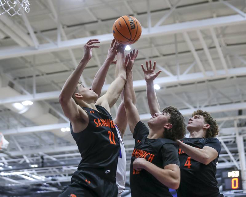 Sandwich's Ej Treptow (21) battles for a rebound during their basketball game between Sandwich at Plano Tuesday, Dec 9, 2025 in Plano.