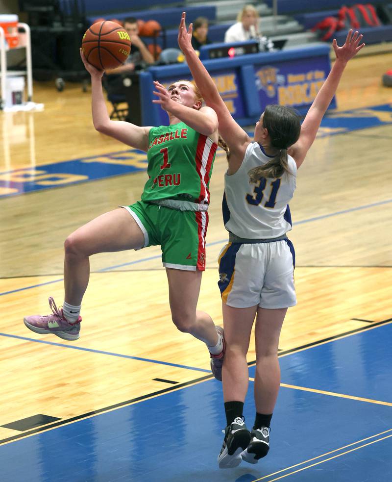 LaSalle-Peru's Addie Duttlinger gets a layup over Somonauk's Brynn Pennington during their game Thursday, Nov. 16, 2023, in the Tim Humes Breakout girls basketball tournament at Somonauk High School.