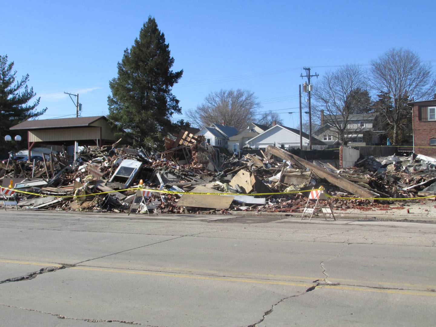 A pile of debris is what's left of LZ Resale and Indoor Shooting Range in downtown Spring Valley after a fire Sunday, April 2, 2023.