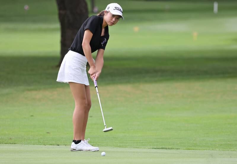 Hampshire’s Kaylee Seo putts on the seventh green Thursday, Sept. 28, 2023, during the Class 2A girls golf regional at Sycamore Golf Club in Sycamore.