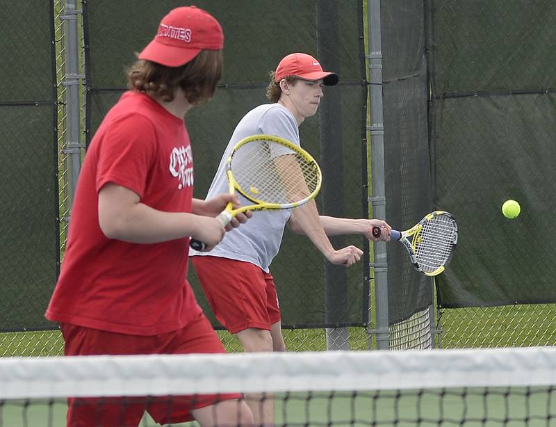 Ottawa's Will Goetz (left) returns a volley while doubles partner Logan Goetsch follows the play at Saturday's Ottawa Invitational on April 23, 2022.