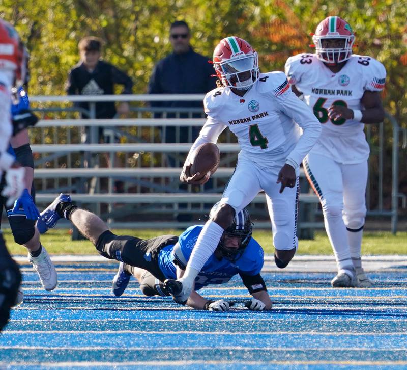 Morgan Park's Marcus Thaxton (4) carries the ball on a keeper against St. Francis during a class 5A state quarterfinal football game at St. Francis High School in Wheaton on Saturday, Nov 11, 2023.