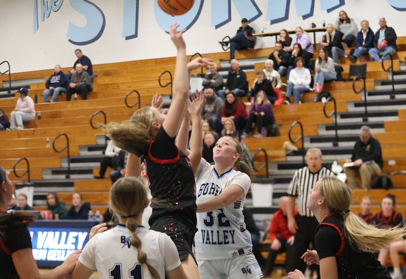 Bureau Valley's Kadyn Haage and Erie-Prophetstown's Lauren Abbott jump for a rebound during the Thanksgiving Tournament on Wednesday, Nov. 19, 2025 at Bureau Valley High School.