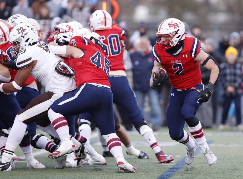 St. Rita's Nick Herman (2) looks to get past the Mt. Carmel defense during the class 7A semi-final playoff game between Mt. Carmel and St. Rita high schools on Saturday, Nov. 23, 2024 in Chicago.