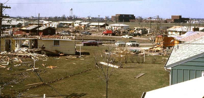 From his roof at 351 Harold St. in Crystal Lake, Larry Lane photographed the damage in the Colby subdivision neighborhood after the Palm Sunday tornado hit the area on April 11, 1965. The Pure Oil research facility in the back ground is now the location of the Jewel-Osco.