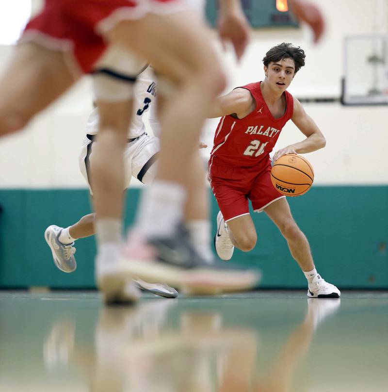 Palatine’s Andy Iliopoulos (20) is pursued by Downers Grove South’s Adam Flowers (3) during the Jack Tosh Holiday Tournament Thursday, Dec. 26, 2024 at York High School in Elmhurst.