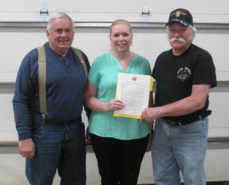 Open Roads ABATE of IL, Inc. Chapter President Cliff Oleson, right, receives a signed proclamation from Little Rock Township Supervisor and Open Roads ABATE member Marcia Newkirk and Little Rock Road Commissioner and Open Roads ABATE member Dick Wade.