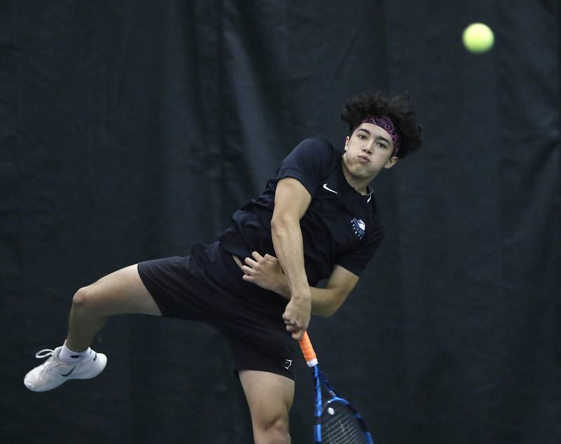 Woodstock North’s Erik Sarabia serves the ball during a IHSA 1A boys double tennis match Thursday, May 26, 2022, at Midtown Athletic Club in Palatine.