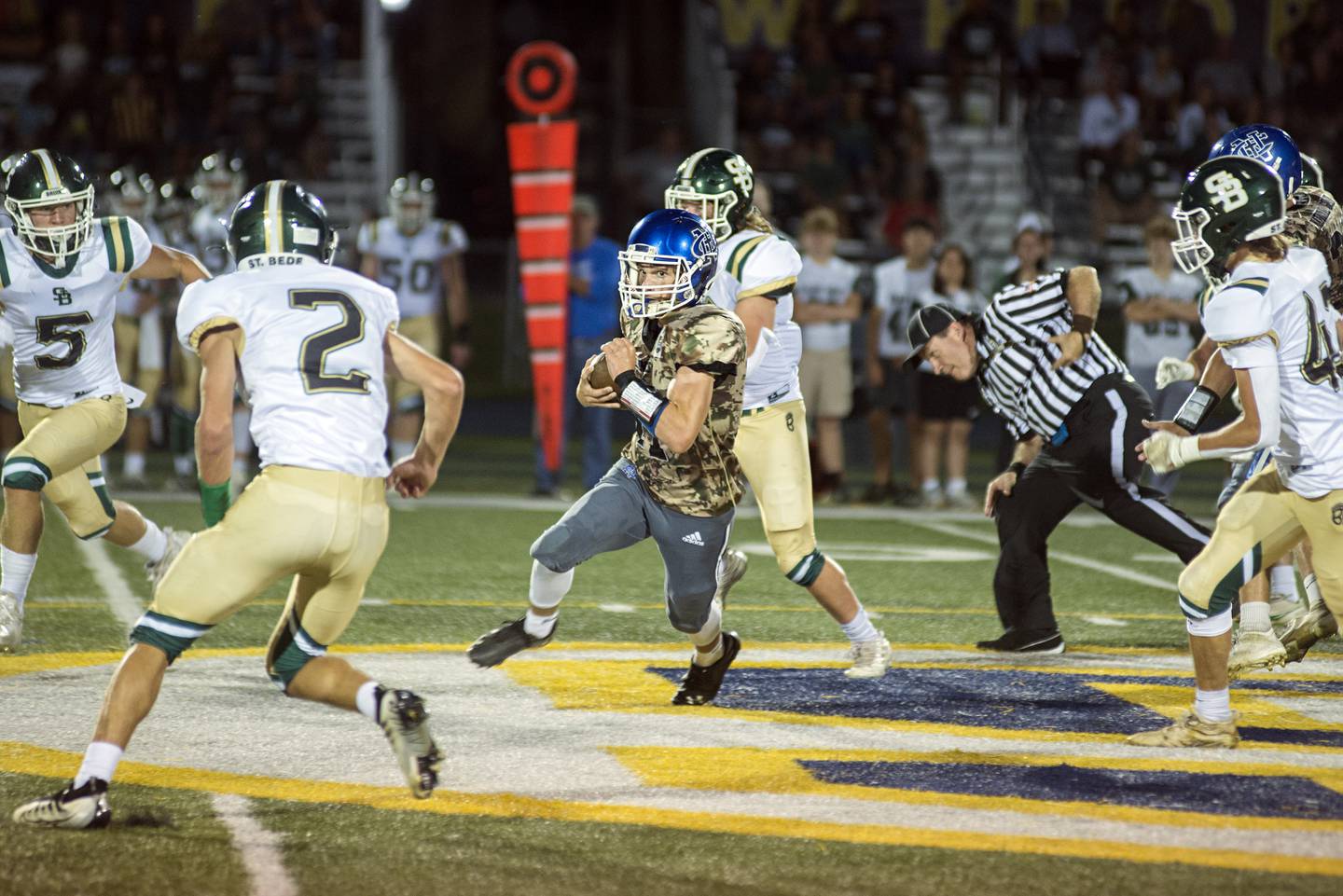 Newman’s Carter Rude picks up yards against St. Bede Friday, Sept. 16, 2022.