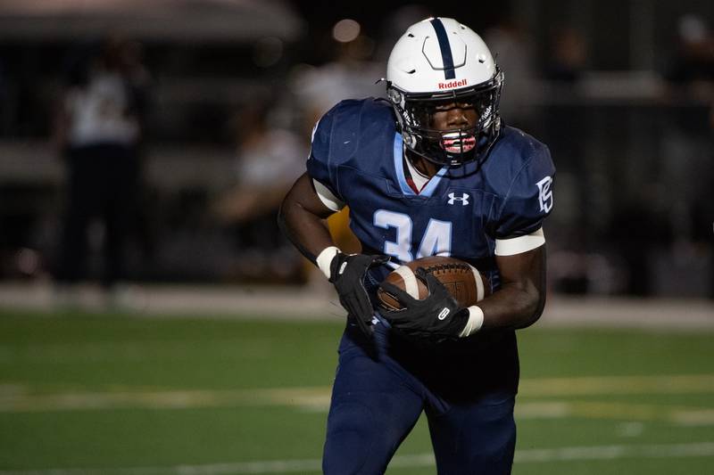 Plainfield South's Prentice Smith runs the ball during a game against Joliet West Friday Oct. 4, 2024 at Plainfield South High School