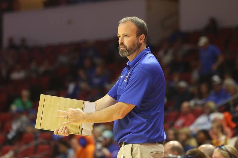 Genoa-Kingston head coach Keith Foster signals in a play against IC Catholic in the Class 2A championship match on Saturday in Normal.