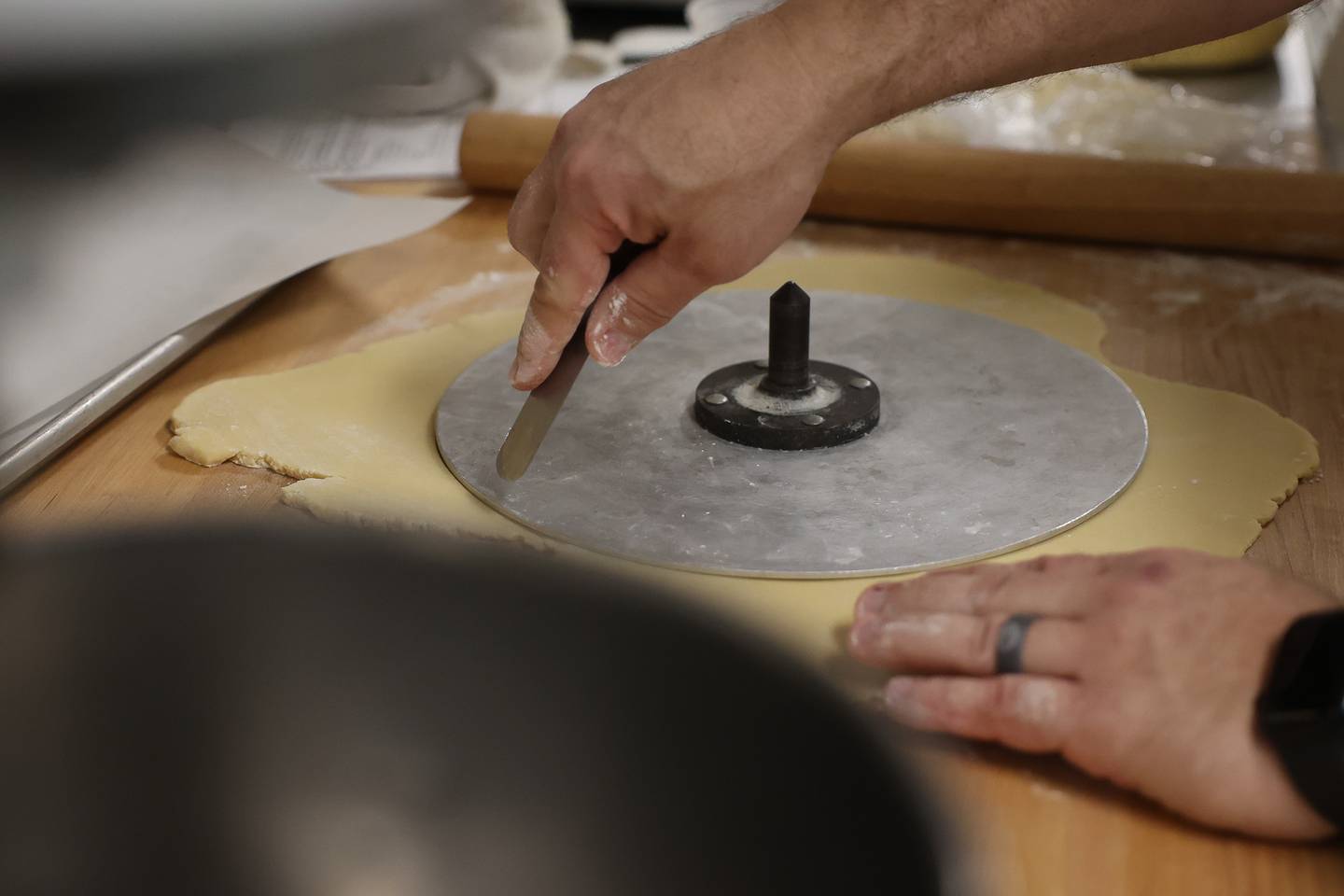 Chef Andy Chlebana works with a student at one of his pastry classes at the Joliet Junior College City Center Campus on Wednesday, March 1st, 2023. Andy has won numerous awards, including 1st place in two competitive television series on the Food Network.