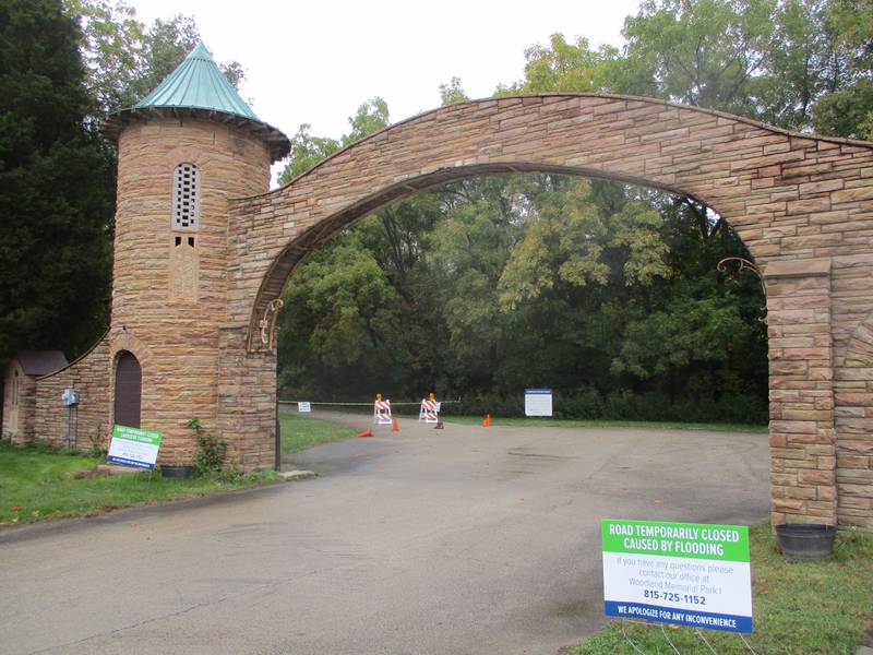 Signs at the entrance to Woodlawn Memorial Park II cemetery just outside Joliet advise that the road leading to gravesites is shut down. Oct. 19, 2023.