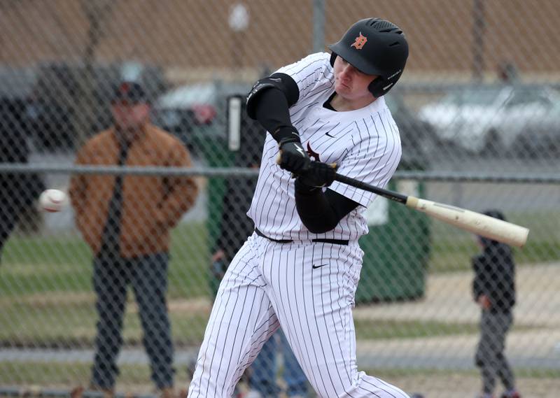 DeKalb's Hunter Kriese takes a cut during their game against Harlem Tuesday, April 1, 2025, at DeKalb High School.