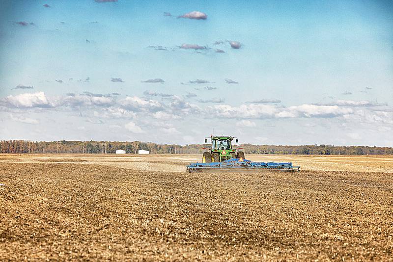 An Iroquois County farmer prepares a field after harvest for next season.