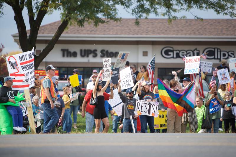 Locals gather at the NO Kings rally along Randall Rd. on Saturday, Oct.18,2025 in Geneva.