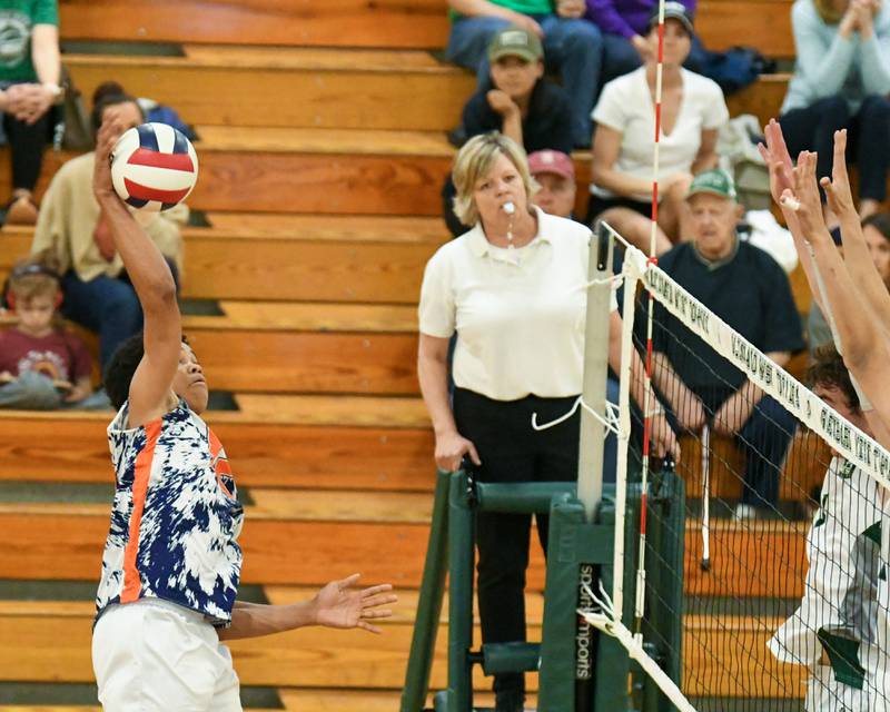 Oak Park-River Forest's Jimmie Chrusfield III (12) spikes the ball during the game on Tuesday April 16, 2024, while traveling to take on Glenbard West at Glenbard West High School.