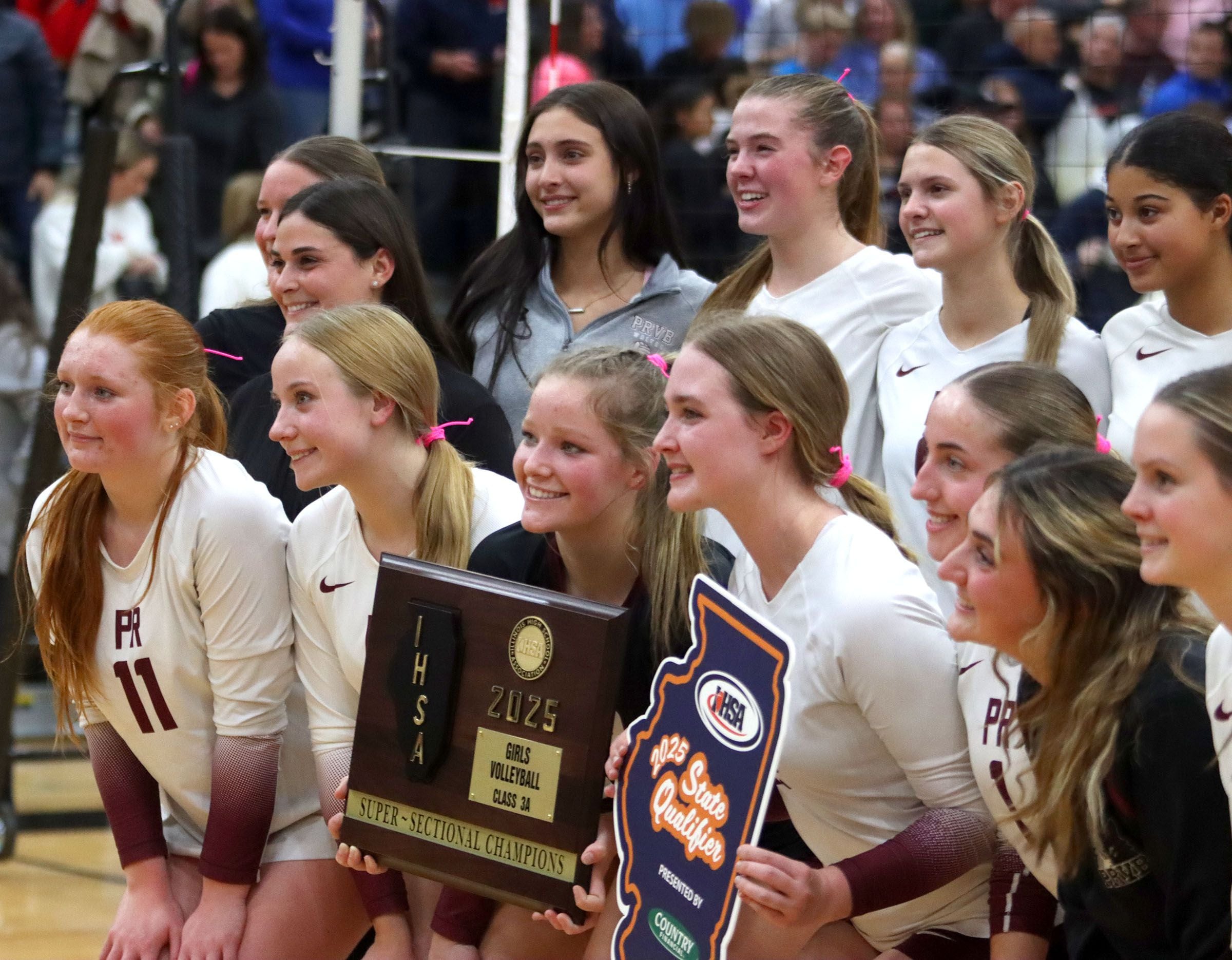 Prairie Ridge’s Wolves enjoy a win against St. Viator in IHSA Class 3A Super-Sectional girls volleyball at Streamwood High School in Streamwood on Monday, November 10, 2025.