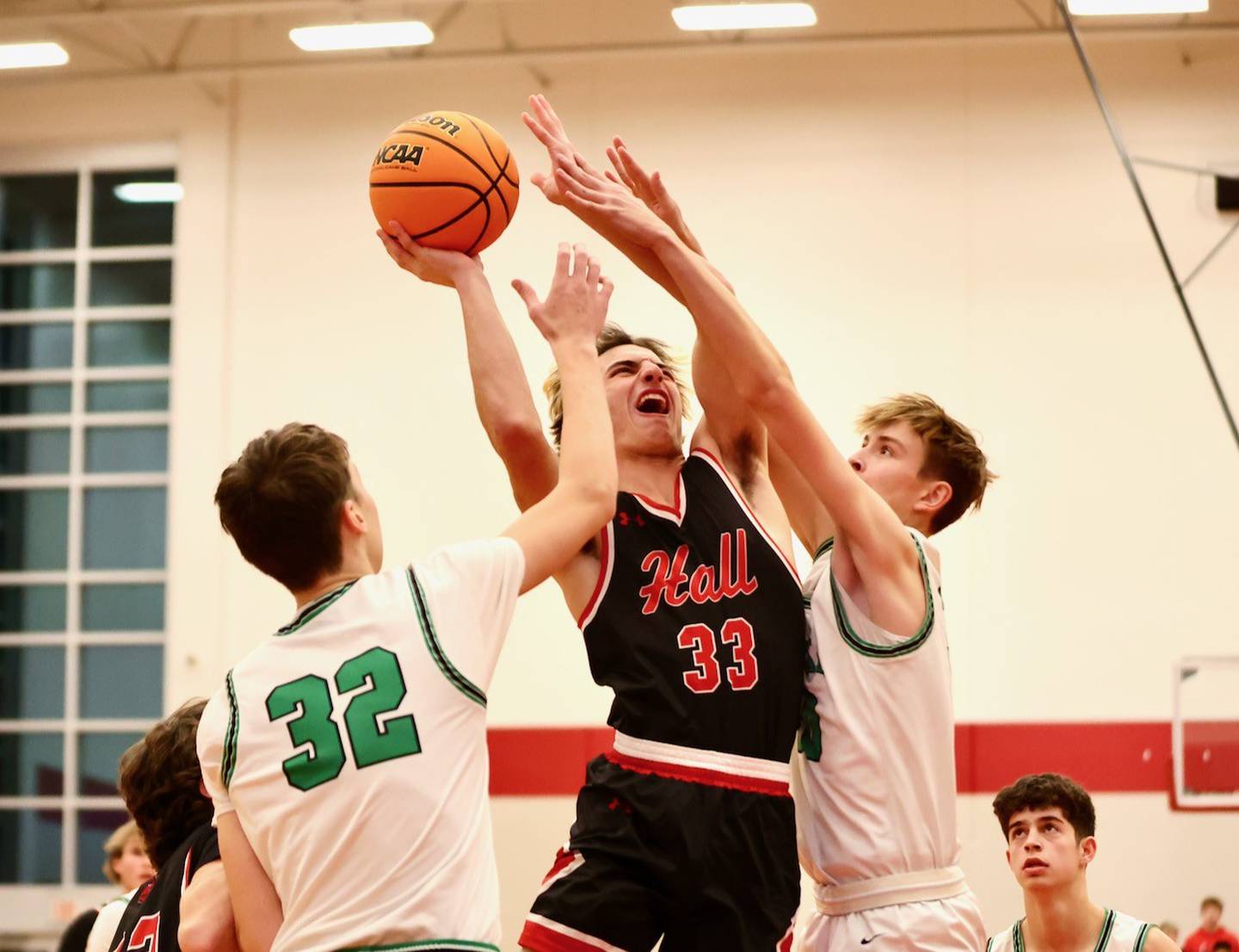 Hall's Braden Curran powers ups against Eureka Tuesday night at Hall High School.