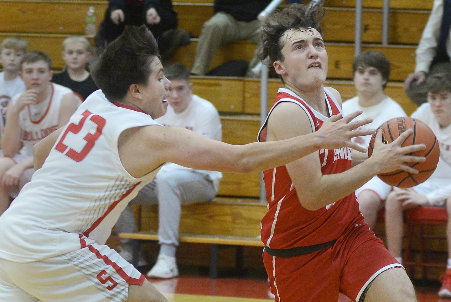 Ottawa Levi Sheehan eyes the basket while trying to cut past Streator defender Logan Aukland (23) in the second quarter Saturday, Dec. 10, 2022, at Pops Dale Gymnasium in Streator.