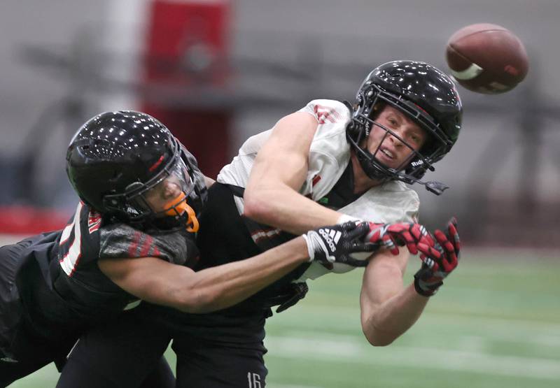 Northern Illinois University defensive back Jacob Finley breaks up a pass intended for receiver Jalen Johnson Tuesday, March 26, 2024, during spring practice in the Chessick Practice Center at NIU.