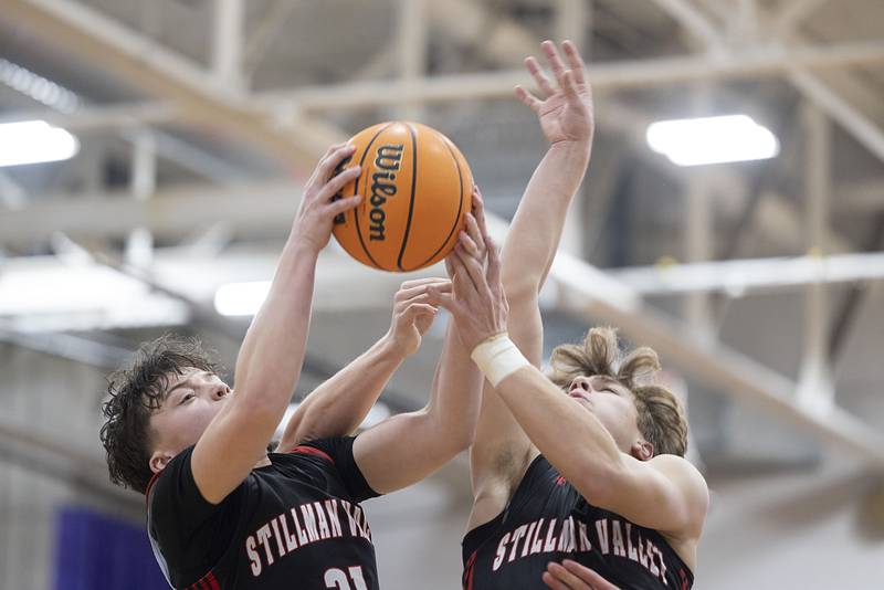 Stillman’s Liam Seabold (left) and Ryan Spangler work for a rebound against Dixon Friday, Jan. 9, 2026.