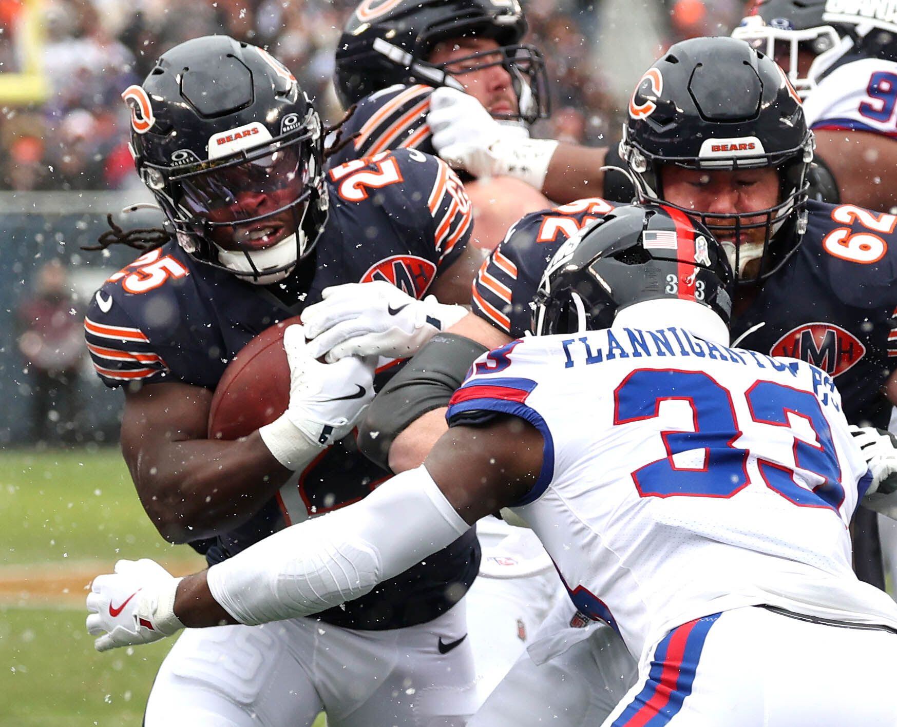Chicago Bears running back Kyle Monangai powers through New York Giants linebacker Demetrius Flannigan-Fowles to score a touchdown Sunday, Nov. 9, 2025, during their game at Soldier Field in Chicago.