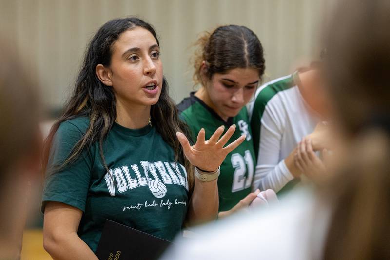 St. Bede Head Coach, Nicole Trenka talks with team after game on Thursday, Sept. 11, 2025 at Abbot Vincent Gymnasium in Peru.