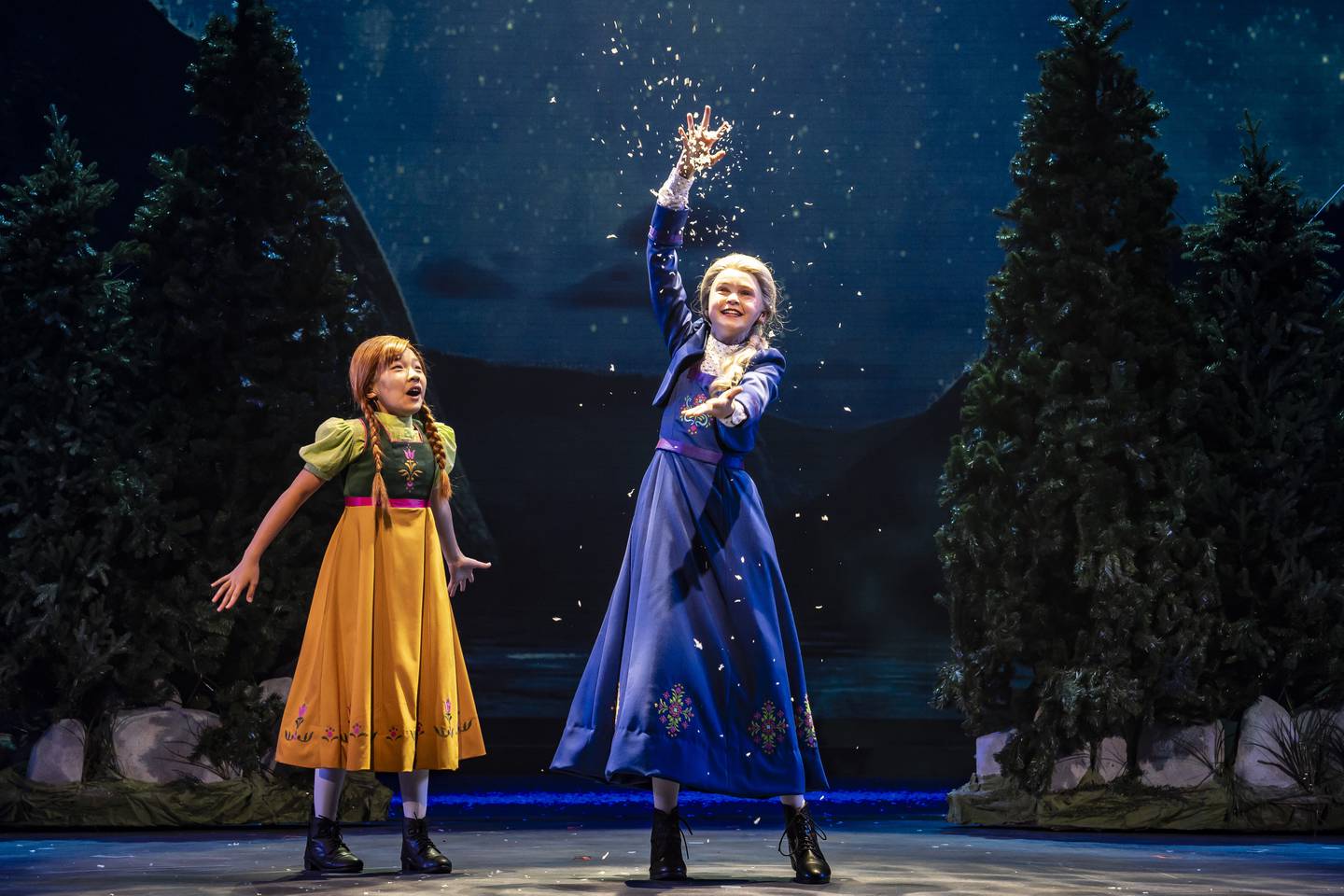 Genevieve Jane (center) plays Young Elsa and Avelyn Choi (left) is Young Anna in Paramount Theatre’s Midwest Regional Premiere of Disney’s Frozen the Broadway Musical. Performances run through January 19, 2025 at Paramount Theatre, 
23 E. Galena Blvd. in downtown Aurora. Tickets: paramountaurora.com or (630) 896-6666. Note: Genevieve and Avelyn alternate performances with Everleigh Murphy as Young Elsa and Elowen Murphy as Young Anna. Credit: Liz Lauren