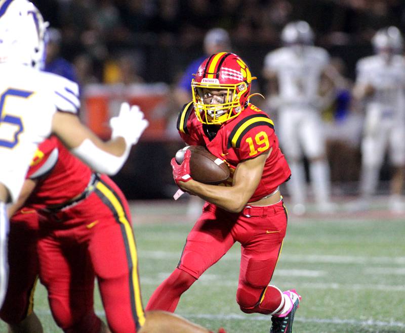 Batavia’s Zach Granberg carries the ball during a home game against Wheaton North on Friday, Sept. 22, 2023.