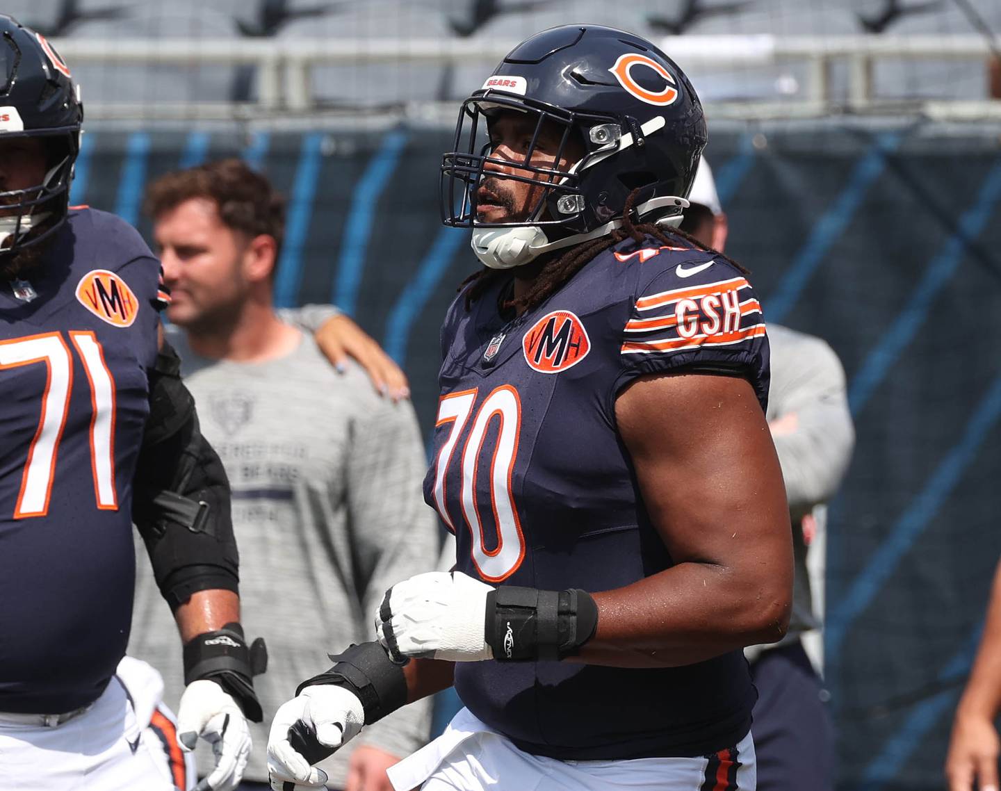 Chicago Bears offensive tackle Braxton Jones runs onto the field Sunday, Aug. 10, 2025, before their preseason game against the Miami Dolphins at Soldier Field in Chicago.