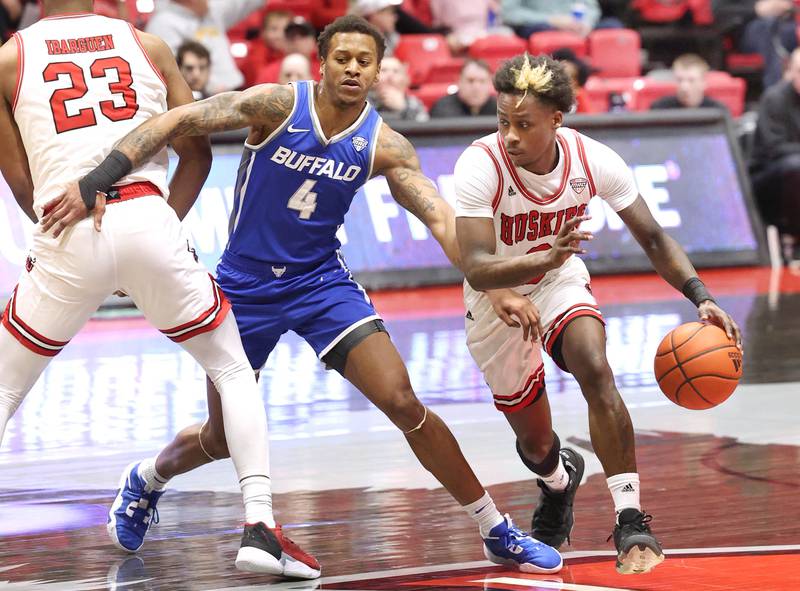 Northern Illinois Huskies forward Harvin Ibarguen screens Buffalo Bulls guard Armoni Foster leaving room for Northern Illinois Huskies guard Kaleb Thornton to get around Foster Tuesday, Feb. 28, 2023, during their conference matchup at the Convocation Center at NIU.
