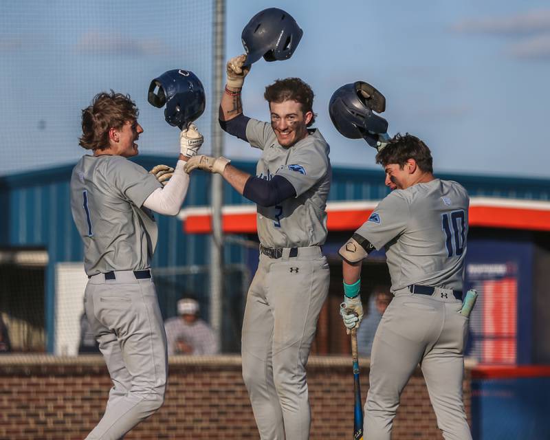 Plainfield South's Caden Pierceall (3) celebrates his homerun at the plate during baseball game between Plainfield South at Oswego on Monday, April 14, 2025 in Oswego.