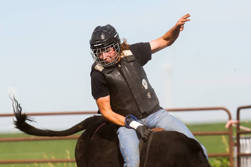 Dominic Dubberstine-Ellerbrock rides a bull during practice at the Rugged Cross Cattle Company. Dominic will be competing in the 2022 National High School Finals Rodeo Bull Riding event on July 17th through the 23rd in Wyoming. Thursday, June 30, 2022 in Grand Ridge.