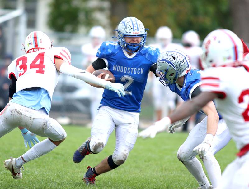 Woodstock’s Maximus Miller looks for running room against Ottawa in varsity football at Larry Dale Field on the campus of Woodstock High School Saturday.