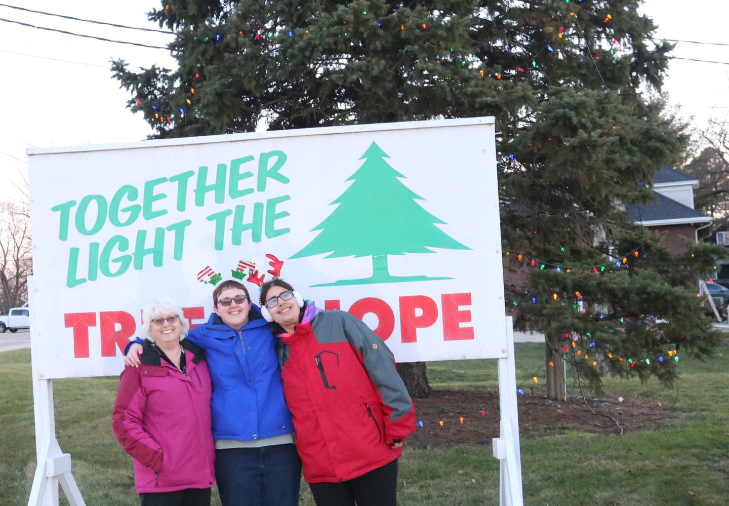 Michelle Rich, Horizon House CEO and Co-chairs Mellissa Lathrop and Bri Hrovat pose for a photo at the Tree of Hope lighting on Wednesday, Dec. 13, 2023 at Horizon House in Peru. Over 75 percent of donations for this year have been met. An additional $12,640 is needed to reach the $60,000 goal. To donate to the Tree of Hope you can mail or drop off donations at Horizon House main office located at 2000 Plank Road in Peru.