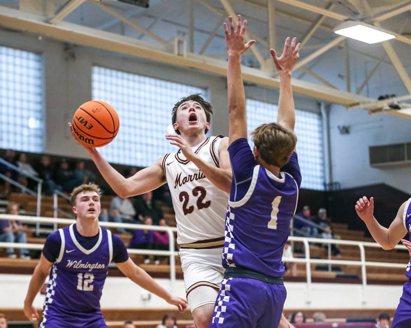 Morris's Brett Bounds (22) puts up a shot defended by Wilmington's Brysen Meents (1) during their basketball game between Wilmington at Morris. Saturday Jan 4, 2025 in Morris.