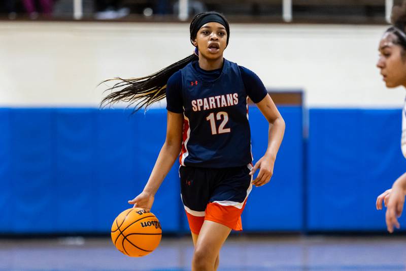 Romeoville's Aaliyah Adams sets up a play during a varsity girls basketball game against Joliet Central at Joliet Central on Dec. 18, 2025.