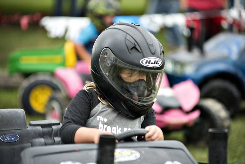 Mackenzye Sprague, 7, of Sterling mixes it up in the kids demo derby at Peat Monster in Morrison on Saturday, Sept. 4, 2021. Half a dozen kids brought in their Powerwheels to go at it like the big kids. The venue played host to the World Series of Demo Derby with over 60 cars smashing it up during the day.