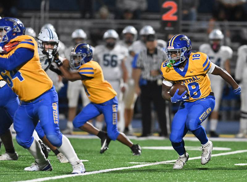 Joliet Central's Tristen Sellers (18) runs the ball during the conference game against Plainfield South on Friday, OCT. 17, 2025, at Joliet.