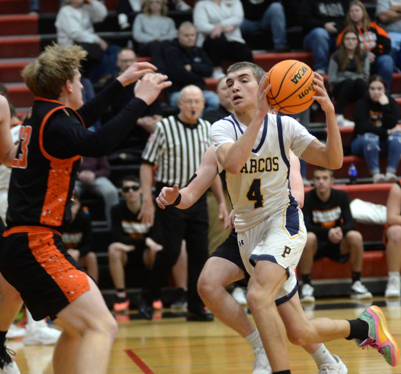 Polo's Mercer Mumford (4) drives to the basket against Warren on Tuesday, Dec. 17, 2024 at the 63rd Annual Forreston Holiday Tournament.