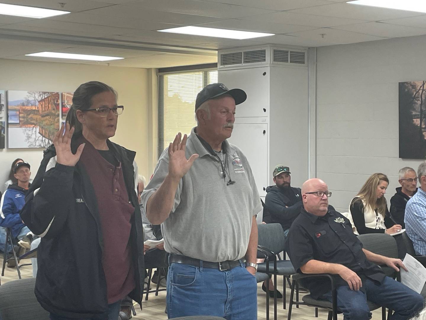 Patricia and Gerhard Ward swear to tell truthful testimony at a Tuesday, Oct. 15, 2024, meeting of the Utica Planning Commission. The Wards want to redevelop nearly 600 acres along the south side of 2803rd Road into Fox Valley Off Road 2.0, a complex for off-road riding.