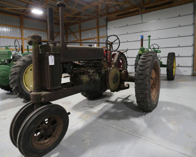 A John Deere Model A tractor was up for bid during the Pat and Sharon Broeren auction on Saturday, Dec. 13, 2025 at Dahl Real Estate Auctions and Appraisals in Walnut. The tractor was made in the 1930's and was the oldest one of the Broeren's collection.