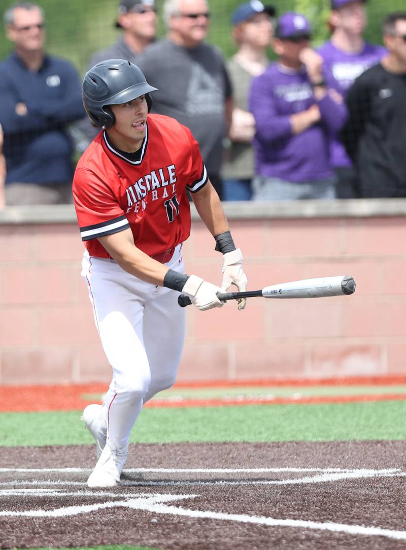 Hinsdale Central's Max Merlo (11) runs after making contact with the ball during the IHSA Class 4A baseball regional final between Downers Grove North and Hinsdale Central at Bolingbrook High School on Saturday, May 27, 2023.