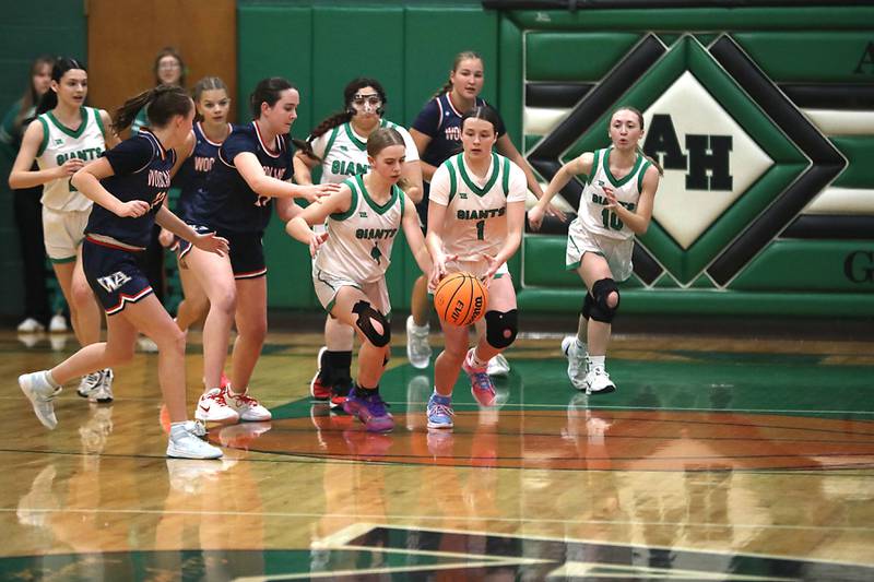 Alden-Hebron's MacKenzie Maule and Hayden Smith try to chase down a loose ball during a nononference girls against Woodlands Academy basketball game on Thursday, Jan. 29, 2026, at Alden-Hebron High School in Hebron.