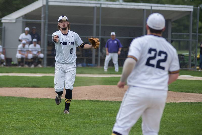 Sterling’s Blake Nettleton tosses to first for an out Tuesday, May 17, 2022 against Dixon.