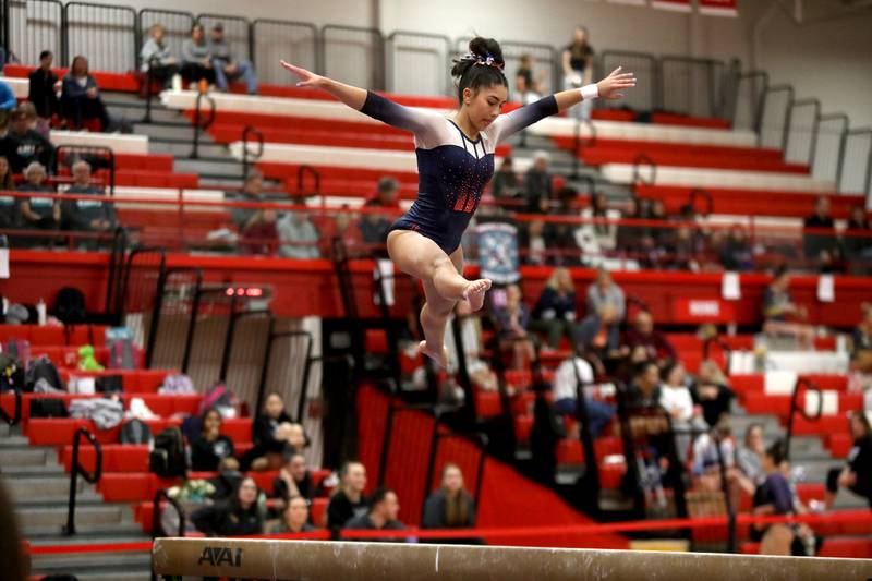 Oswego Co-op’s Veda Haake competes on the balance beam during the Hinsdale Central Sectional on Monday, Feb. 10, 2025 in Hinsdale.