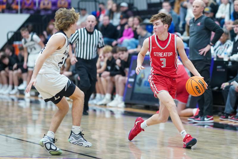 Streator's Nolan Ketcham (3) brings the ball up the court against Kaneland’s Luke Reinert (24) during a semi-final basketball game in the 61st annual Plano Christmas Classic at Plano High School on Friday, December 27, 2024.